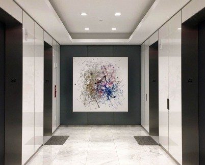 White and gold art in an elevator area