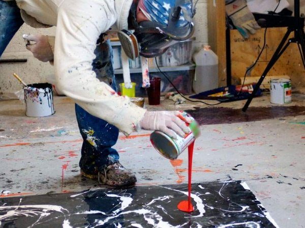 pouring paint from a can