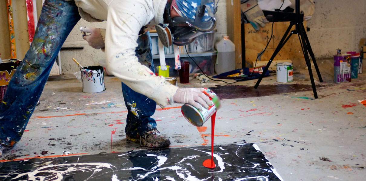 pouring paint from a can