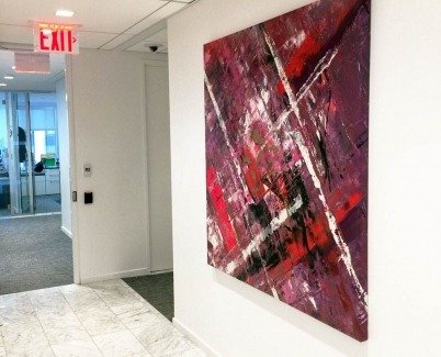 Pink and red painting in a corridor