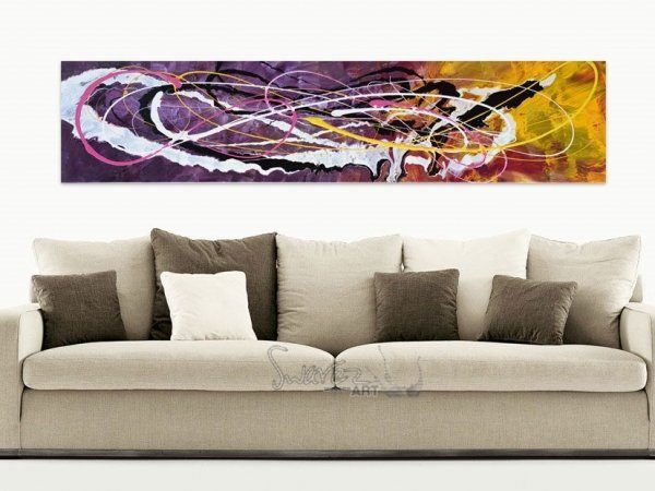 purple and yellow art above a taupe sofa