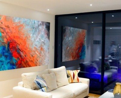 Red and blue art in a modern living room