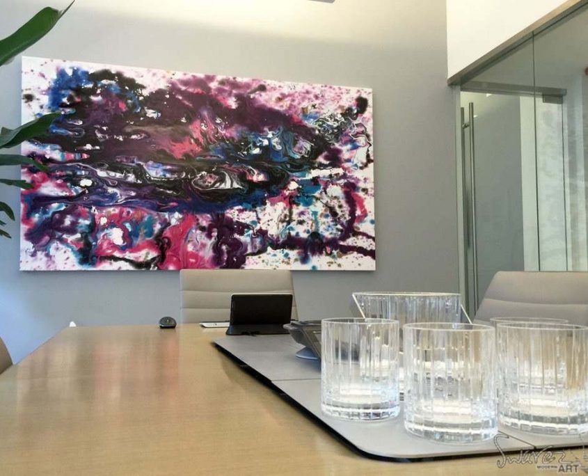 Purple and pink art in a boardroom