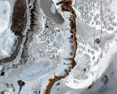 Droplets of silver and white paint