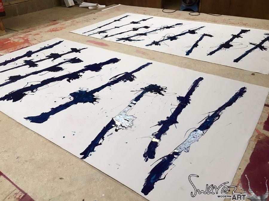 Laying out blue poles on canvas