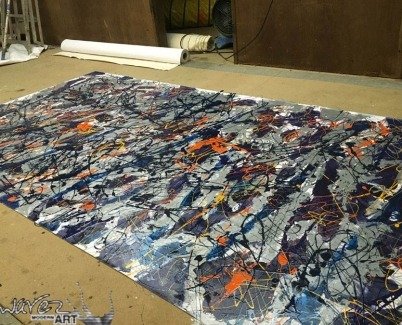 Working on a large drip painting