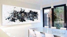 large black and white painting in a dining room