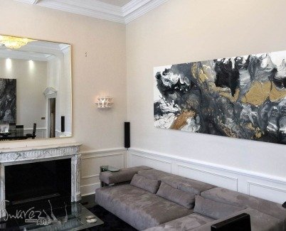 Terraformer painting and grey sofa