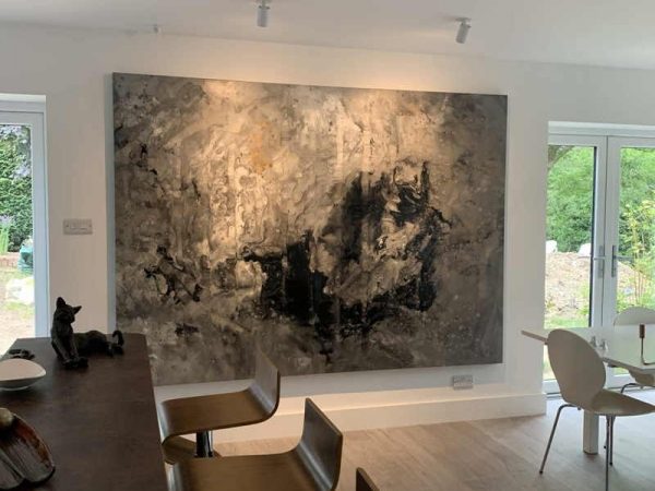large grey and white abstract painting in open plan kitchen