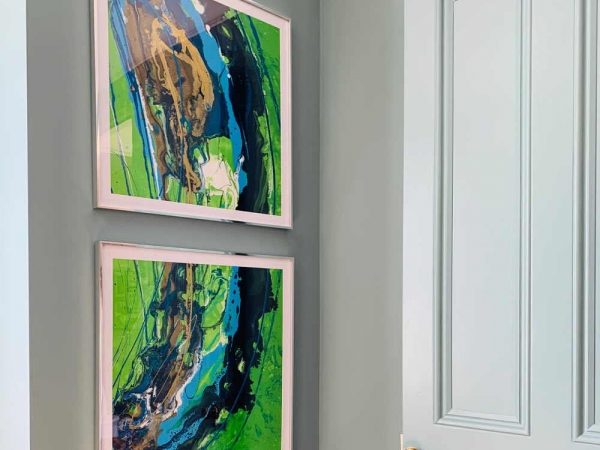 two square green and blue original abstract art works in frames