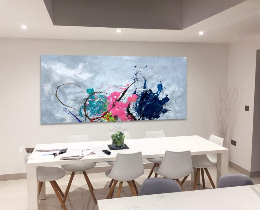 white dining table and rectangular abstract art behind