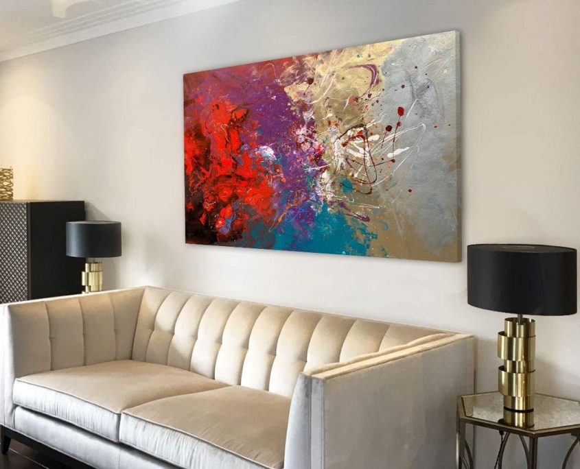 abstract painting above a sofa