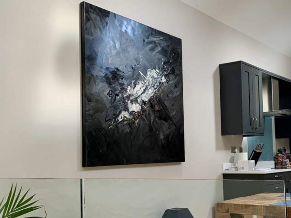 black and white modern art in clean open living space