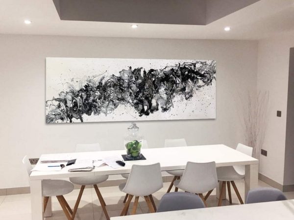 black and white abstract in a dining room space