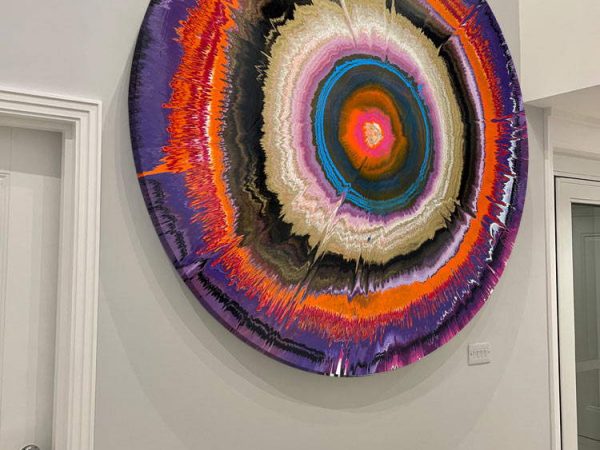 round abstract painting on a wall