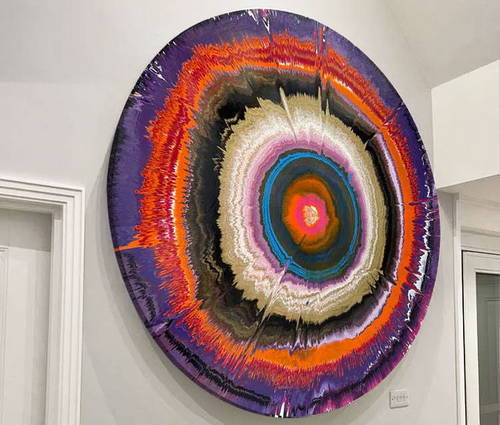 round-abstract-painting-on-a-wall