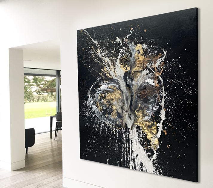 very large black painting with gold and silver on a wall
