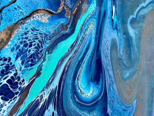 swirls of blue paint on a painting
