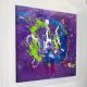 lime-green-and-purple-modern-art-on-a-wall