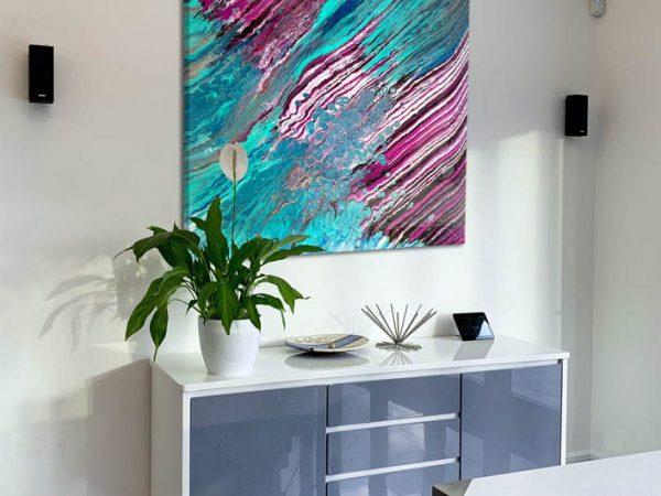pink turquoise painting above a console table