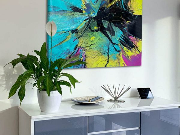 abstract art above a console table