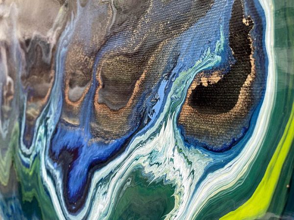 swirls of blue and green paint on canvas