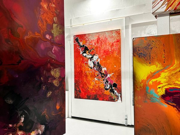 red-and-orange-paintings-hanging