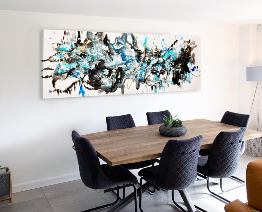 blue and black painting in abstract style in a dining room