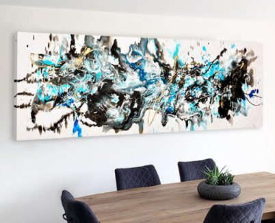 long abstract art above a dining table