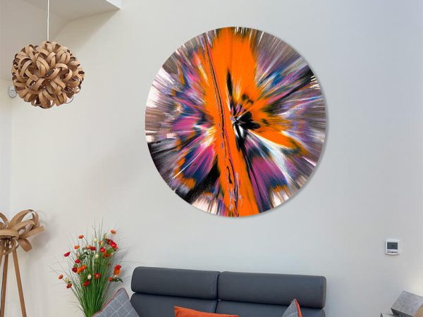 round spin painting above a grey sofa
