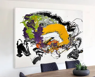 green purple and white art in a dining room