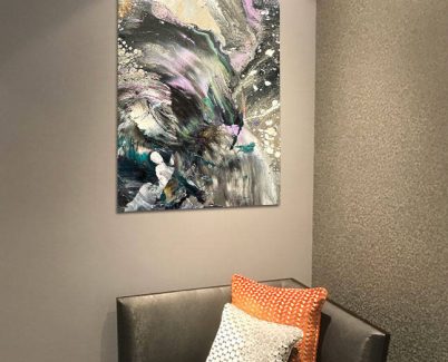 DARK-ENERGY-ACRYIC-PRINT black and grey print above a chair