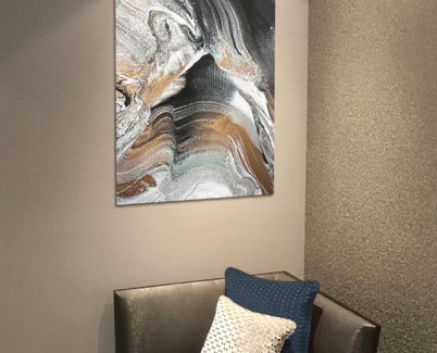 GLACIAL-RIFT-ACRYIC-PRINT monochrome acrylic art print above a casual chair