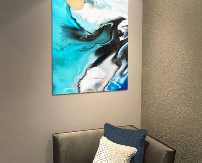 blue acrylic art print above a casual chair