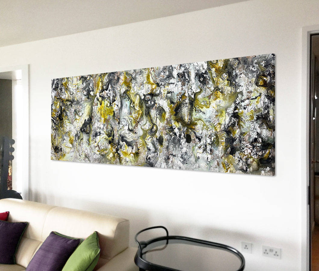 grey and yellow painting above a sofa