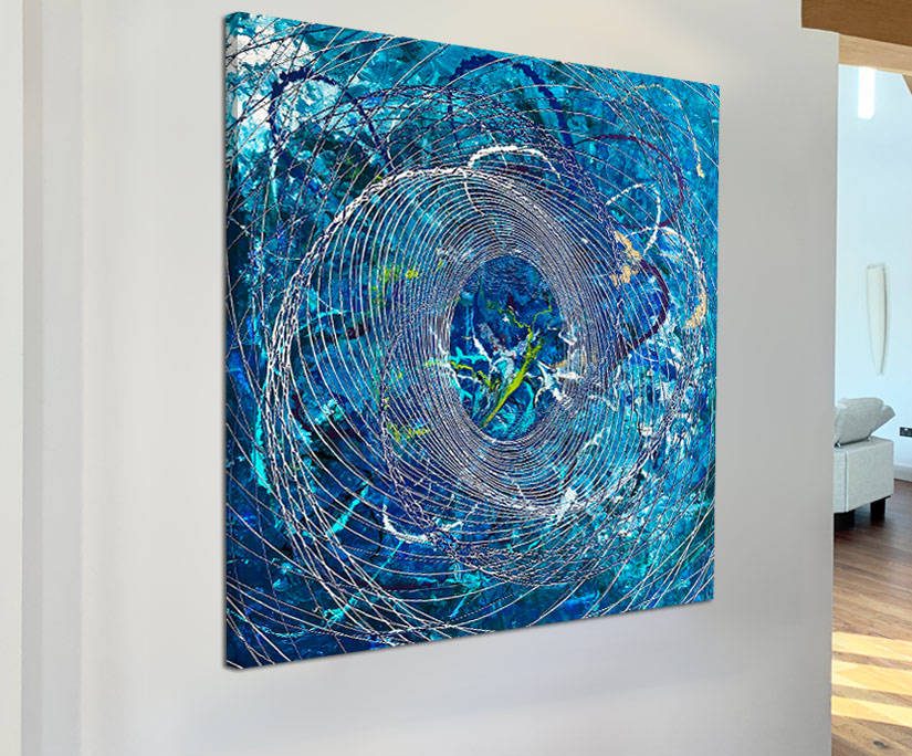 large white wall with abstract painting hanging on it