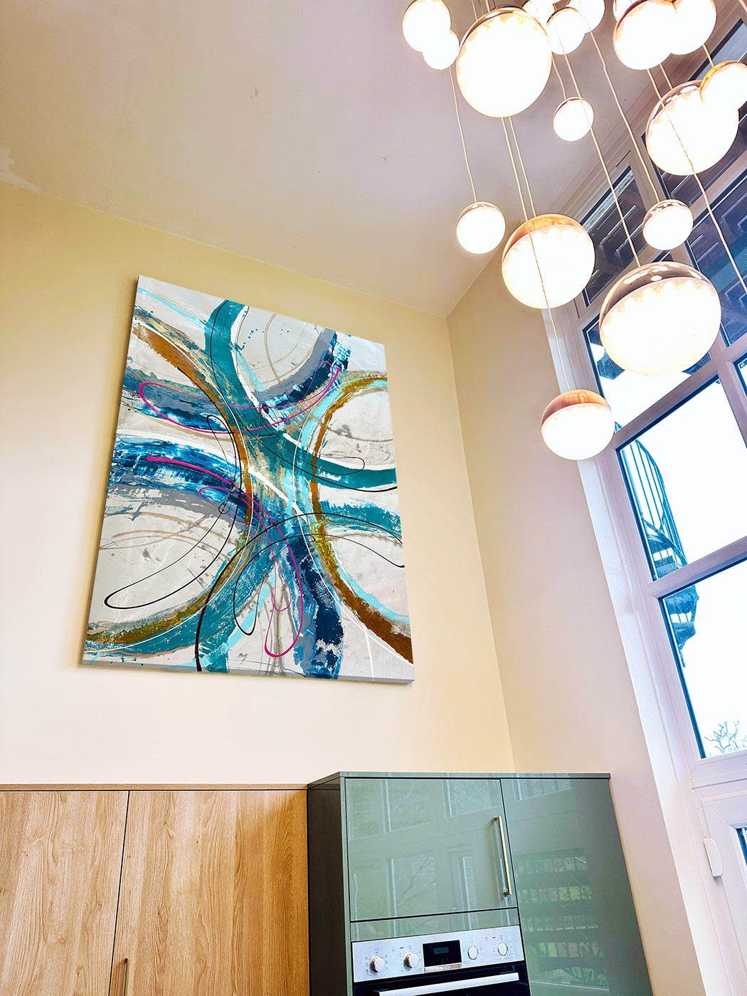 large turquoise green and blue painting in a double height entrance large turquoise green and blue painting in a double height entrance