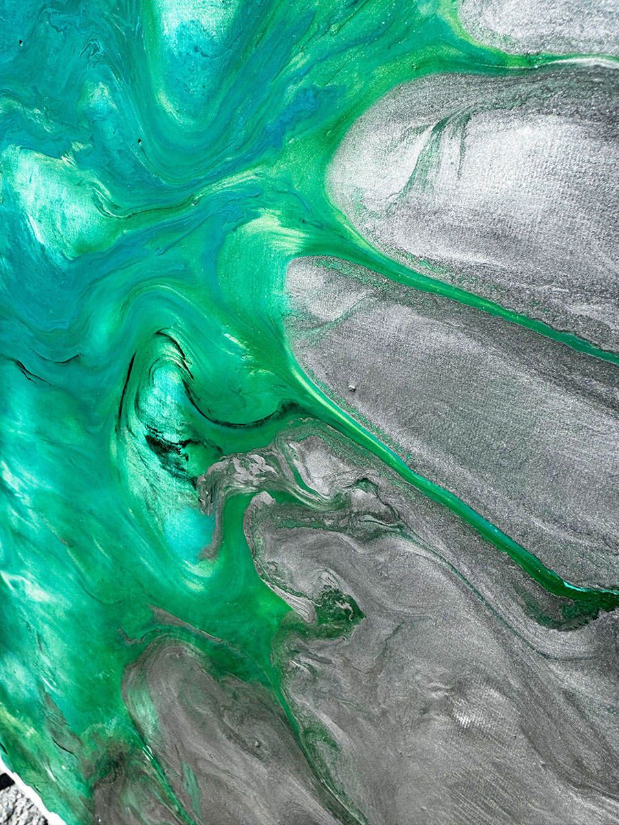 metallic silver and green paints flowing on canvas metallic silver and green paints flowing on canvas